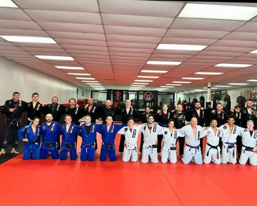 Brazilian Jiu Jisu pracicioners posing for a phodo.