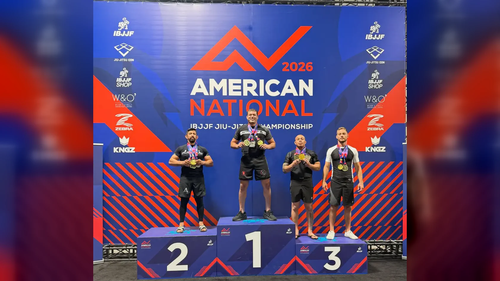 Guybson Sa on the podium after winning the American National BJJ Championship 2026